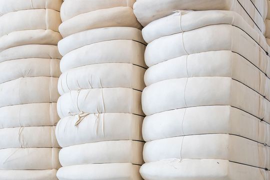 Cotton bales placed on each other in a mill storage